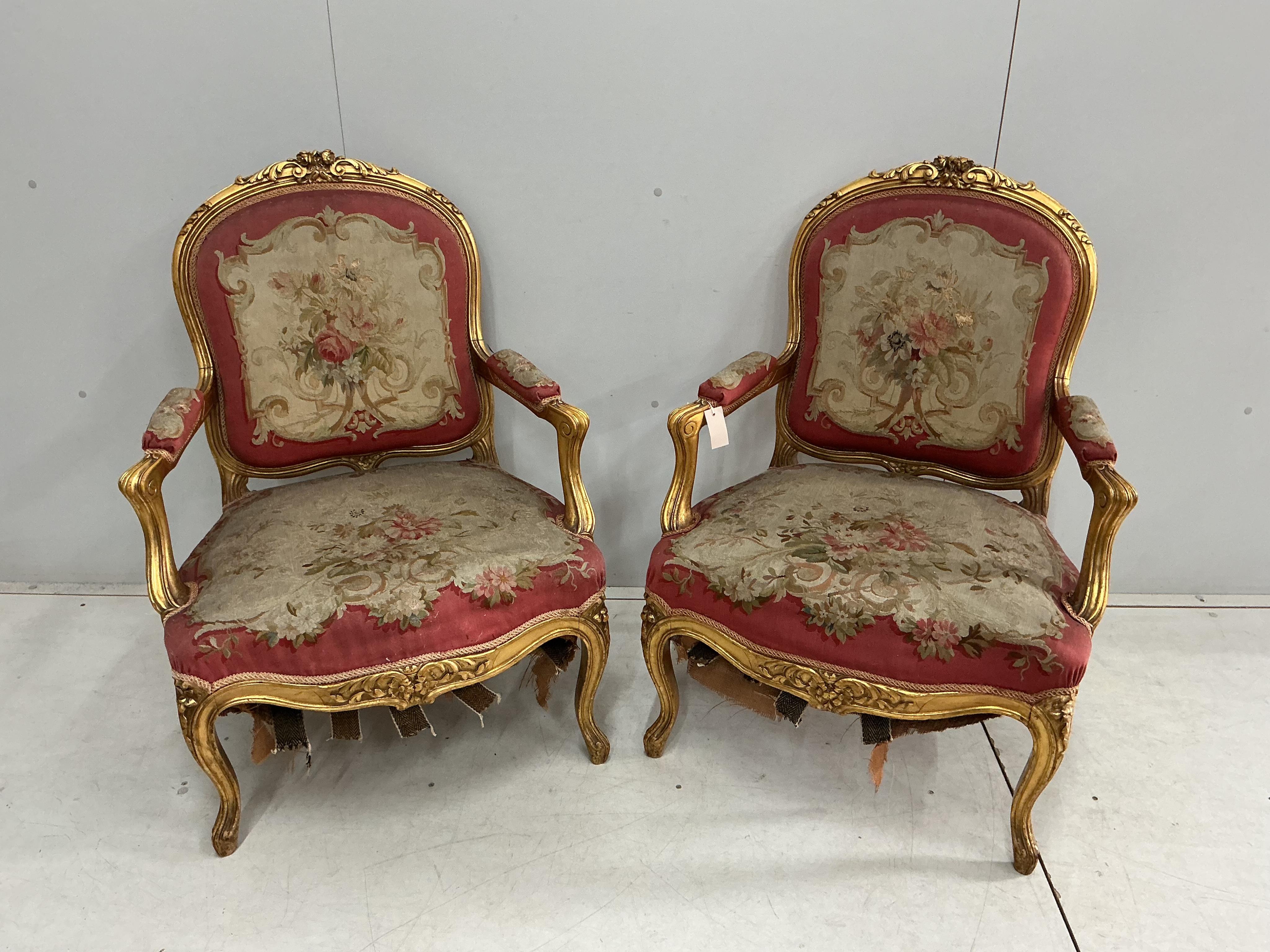 A pair of 18th century style giltwood and composition elbow chairs with petit point tapestry seats and backs, width 74cm, depth 52cm, height 96cm